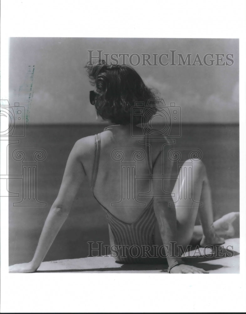 1989 Press Photo Woman enjoying the sun - hcx04156- Historic Images