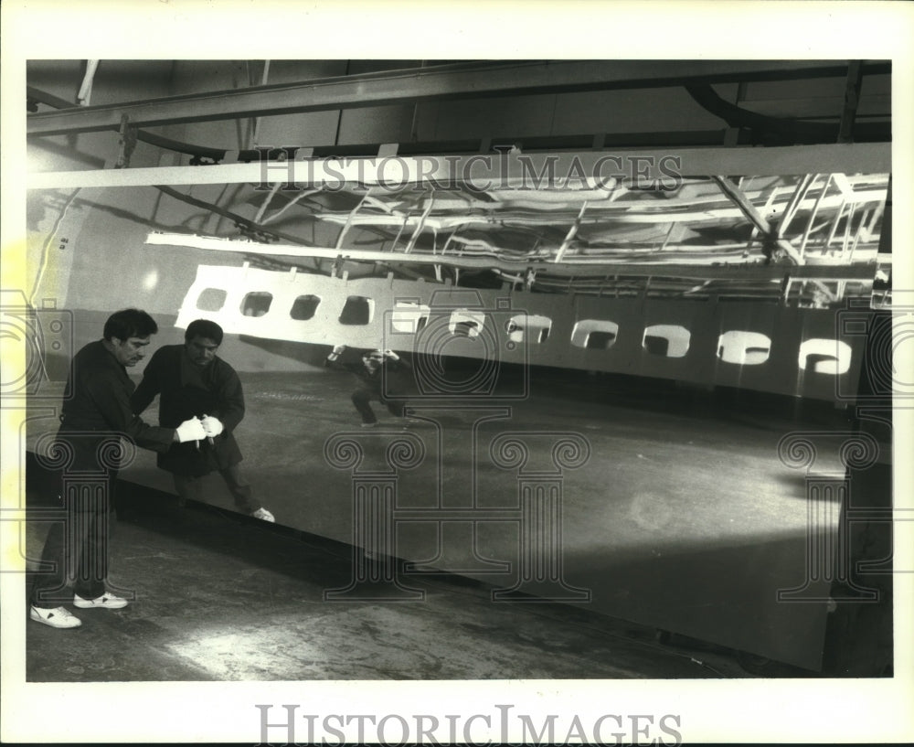 1987 Press Photo Northrop Corporation Tech Finishes Jetliner Panel, California- Historic Images