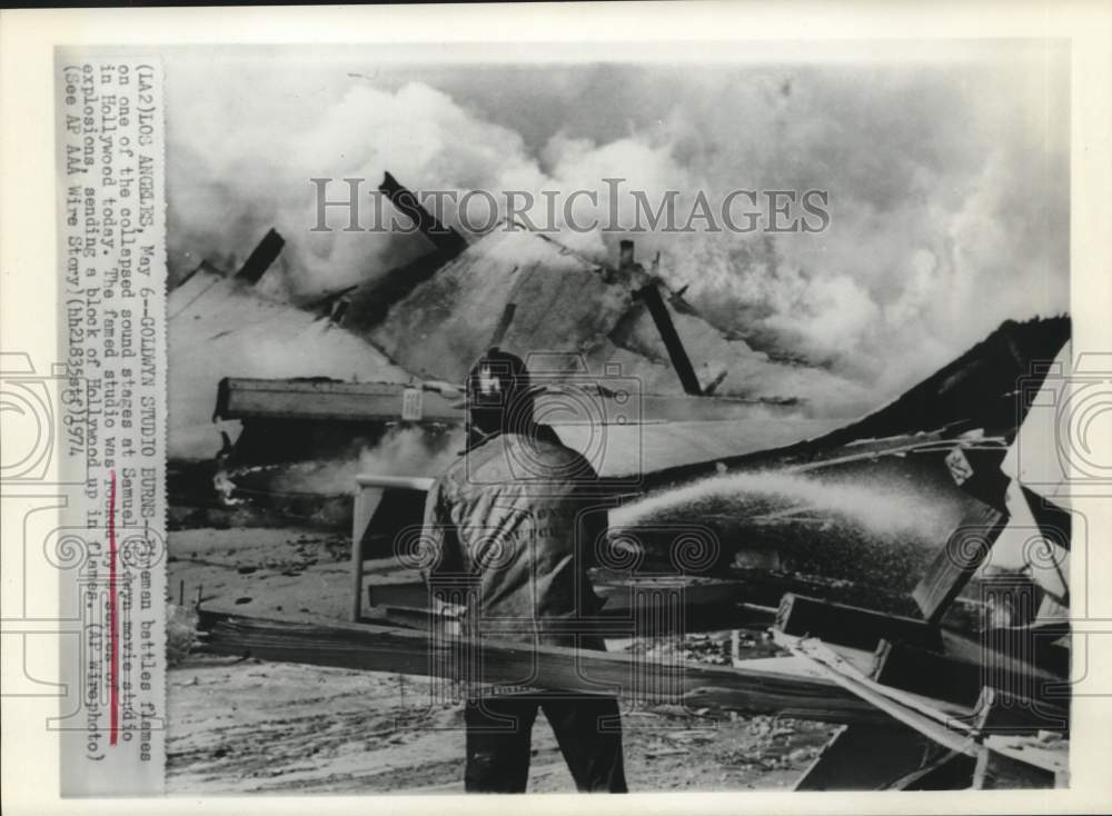 1974 Press Photo Fireman Hoses Down Burning Samuel Goldwyn Studios, Hollywood