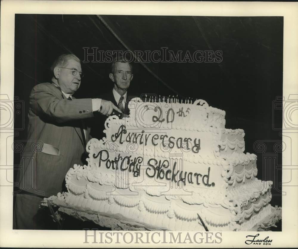 1951 Press Photo Man cuts large cake celebrating Port City Stockyard - hcx16898- Historic Images