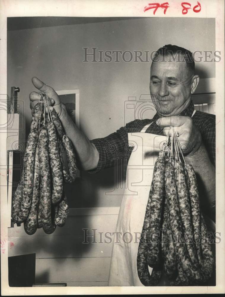 1967 Press Photo Mr. Eckermann admires his sausages in Texas - hcx17612