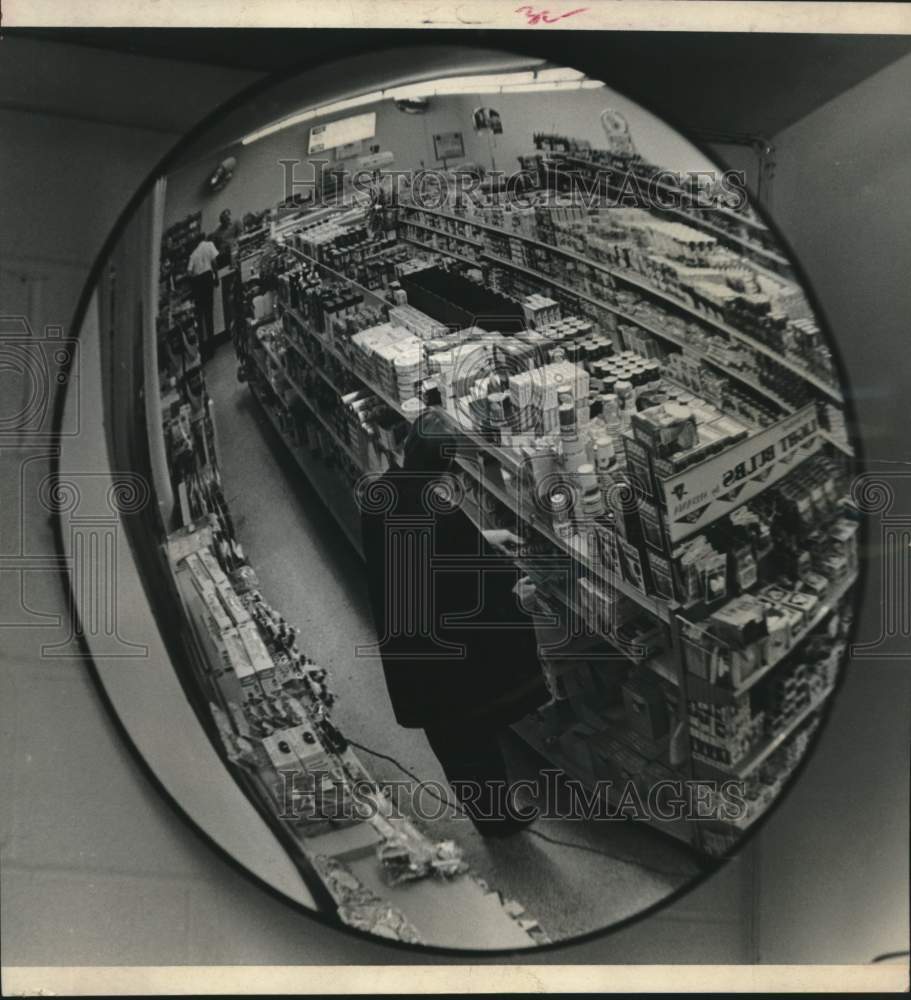 1969 Press Photo Customer seen in store's fish-eye mirror in Houston - hcx17822- Historic Images