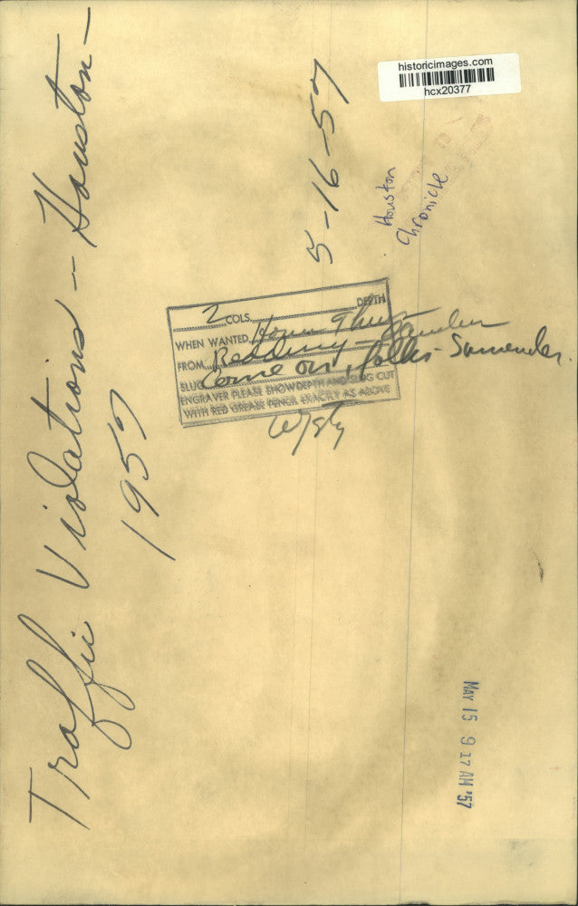 1957 Press Photo Man by file cabinet filled with Houston traffic violations