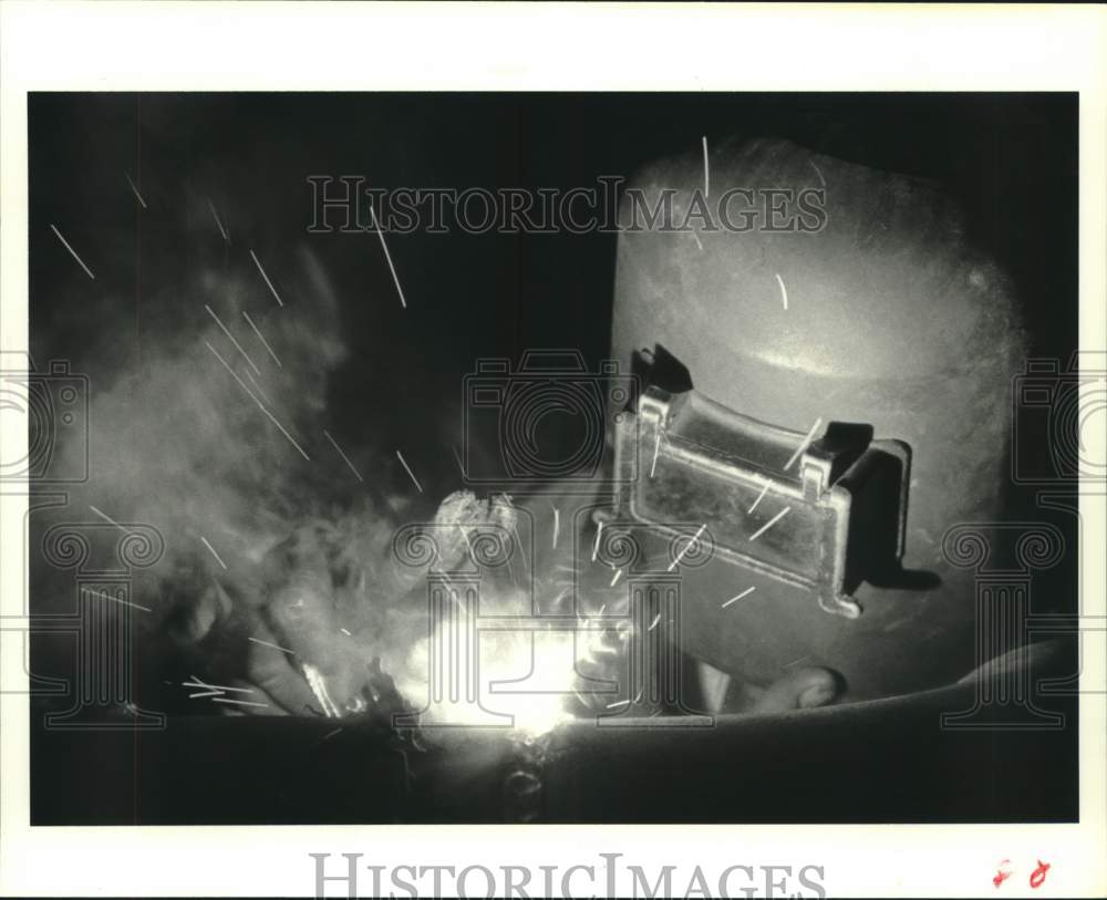 1979 Press Photo R. C. Branch welds pipe on Prairie Street in Houston at night