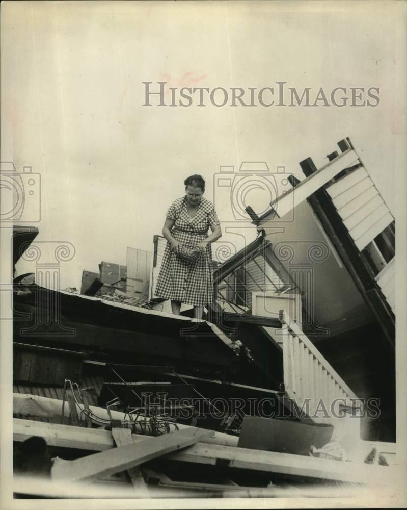 1961 Press Photo Woman stands atop her ruined home - Hurricane Carla - Texas- Historic Images