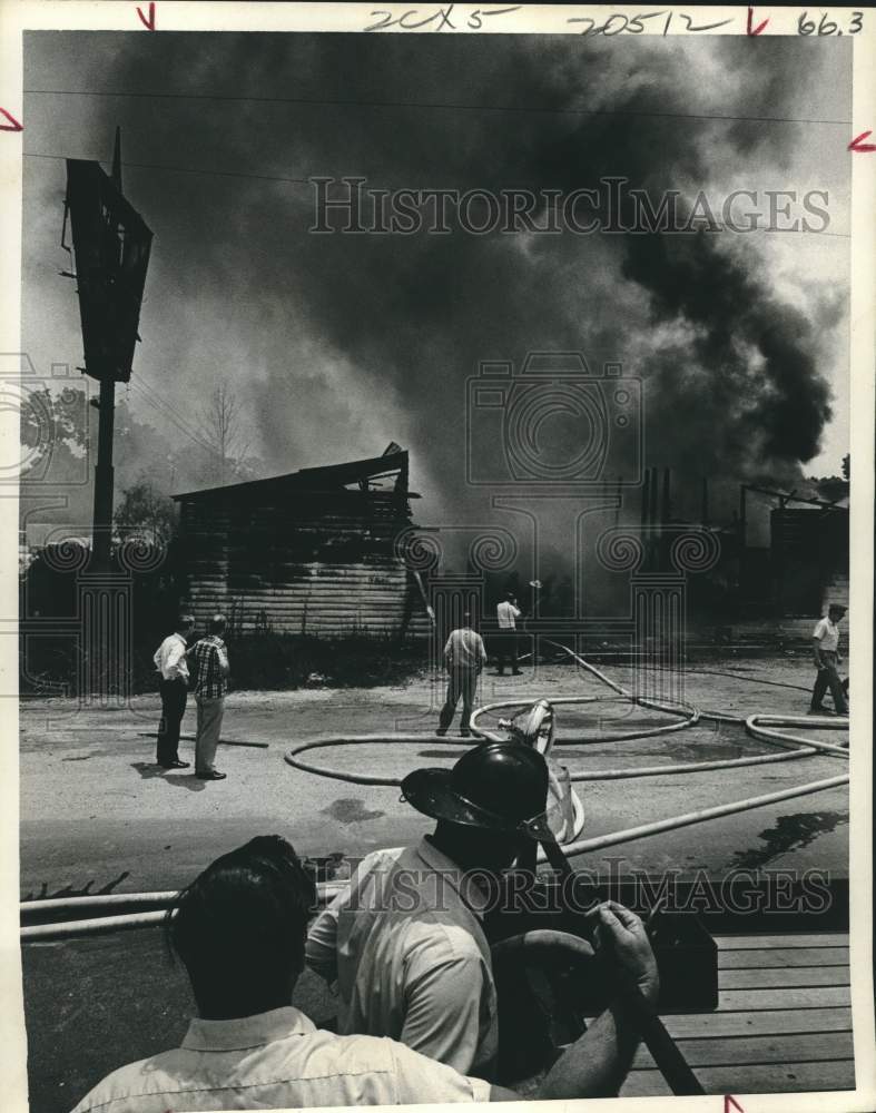 1969 Press Photo Firemen on scene of vacant building in Houston - hcx33152- Historic Images