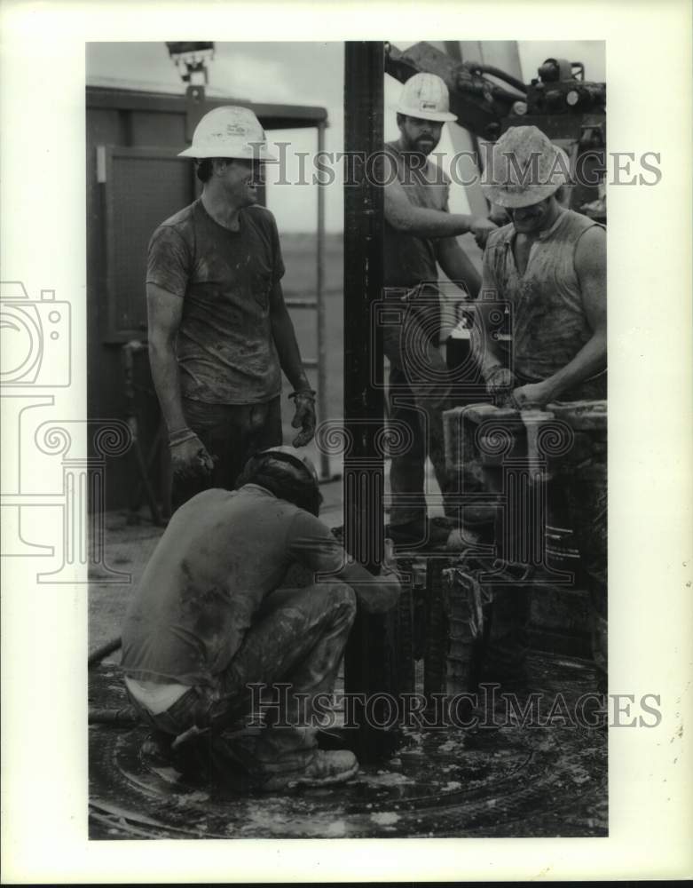 1990 Press Photo Workers on an oil well in Texas - hcx40698