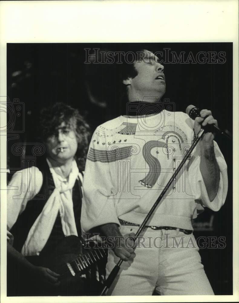 1985 Press Photo Rock band The Firm perform on stage - hcx42236