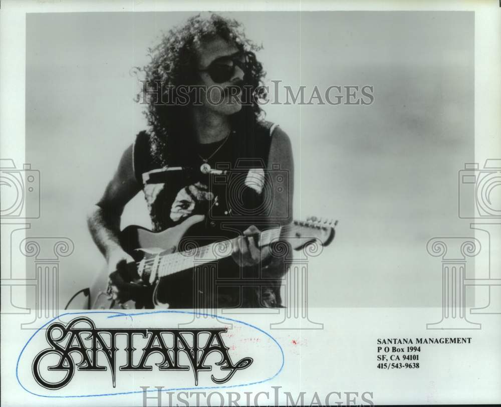 1987 Press Photo Musician Carlos Santa plays guitar outside - hcx42498- Historic Images