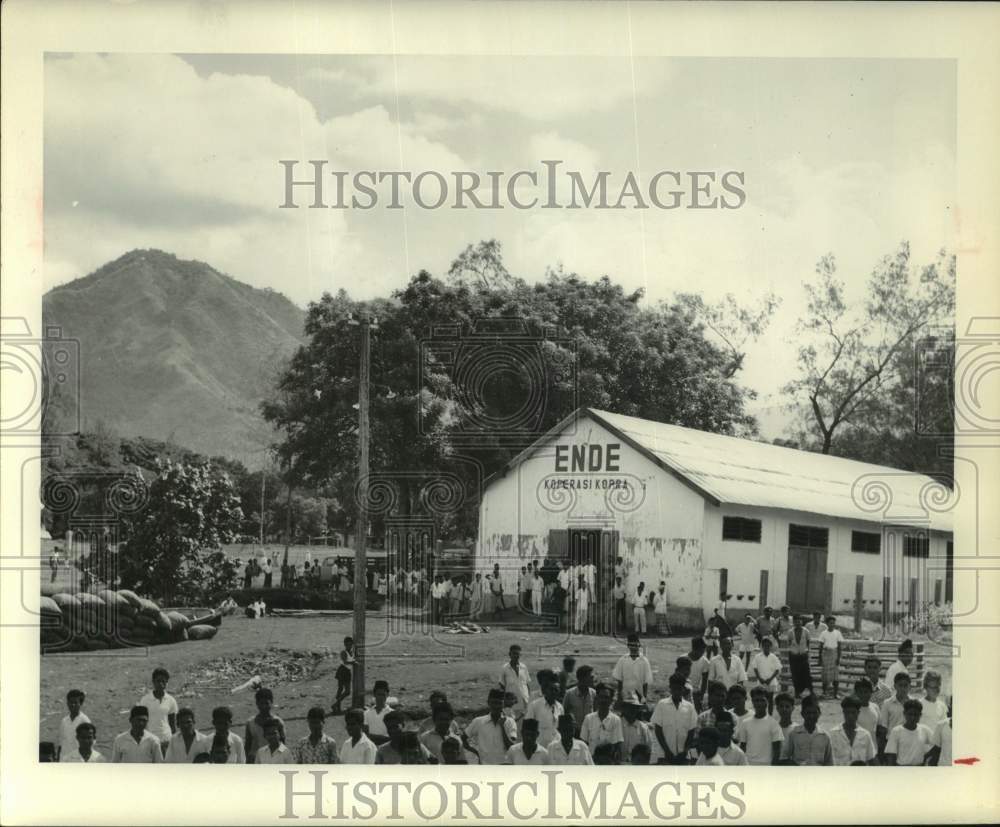 1961 Press Photo People Stand Near Building Waiting for Ship SS Hope - hcx42888- Historic Images