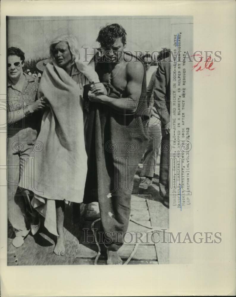 1963 Press Photo Jayne Mansfield's Husband Helps After Rescue, Nassau, Bahama- Historic Images