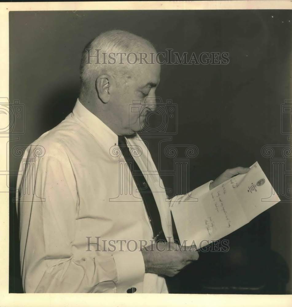 1957 Press Photo W.D. Miller, Houston County Clerk reads letter - hcx51316- Historic Images