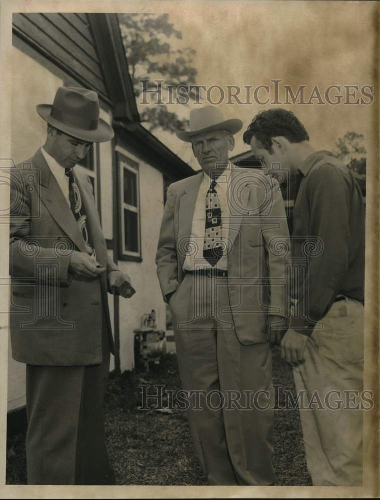 1956 Press Photo Detective talks to William Rollins - hcx52073- Historic Images