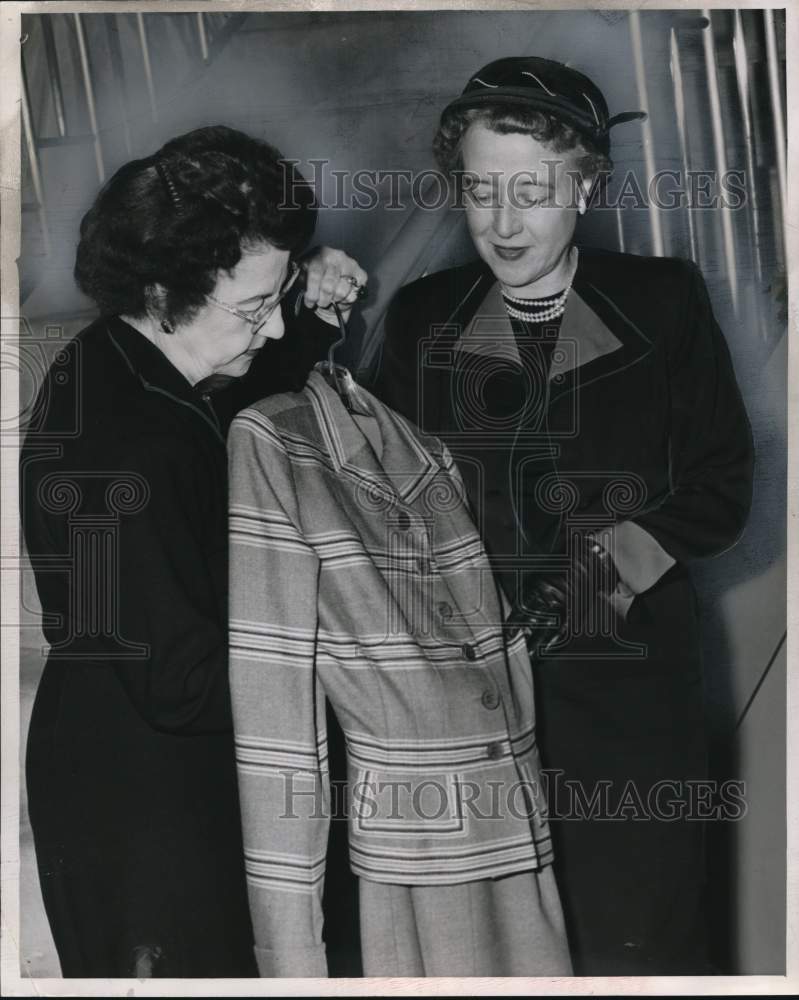 1951 Press Photo Women admire dress during Stockard shopping. - hcx52330- Historic Images