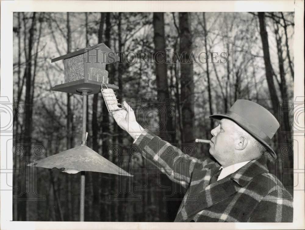 1953 Press Photo AFL President George Meany Fills Birdfeeder at Maryland Home- Historic Images