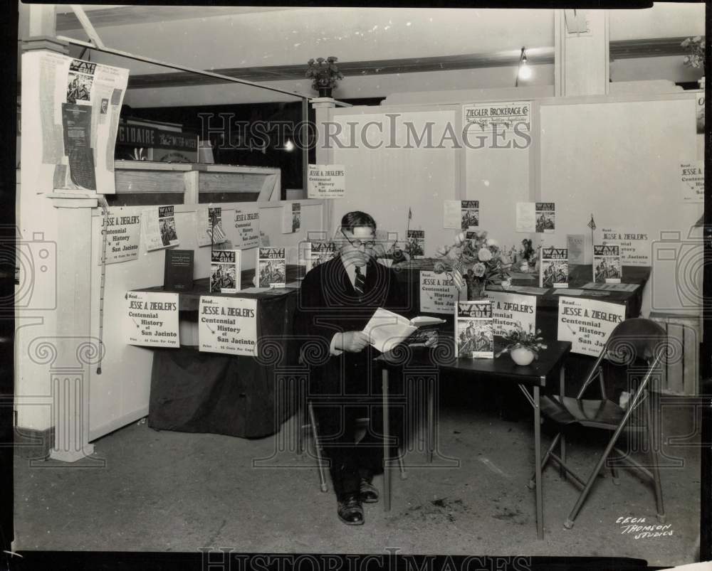 1947 Press Photo Author Jesse Ziegler beside display of his books - hcx54596- Historic Images