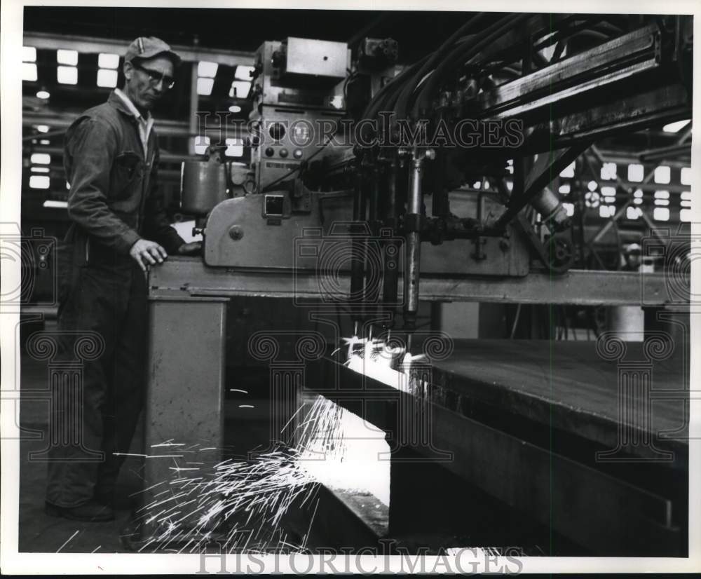 1964 Press Photo Worker using equipment fueled by Dow Chemical industrial gas.