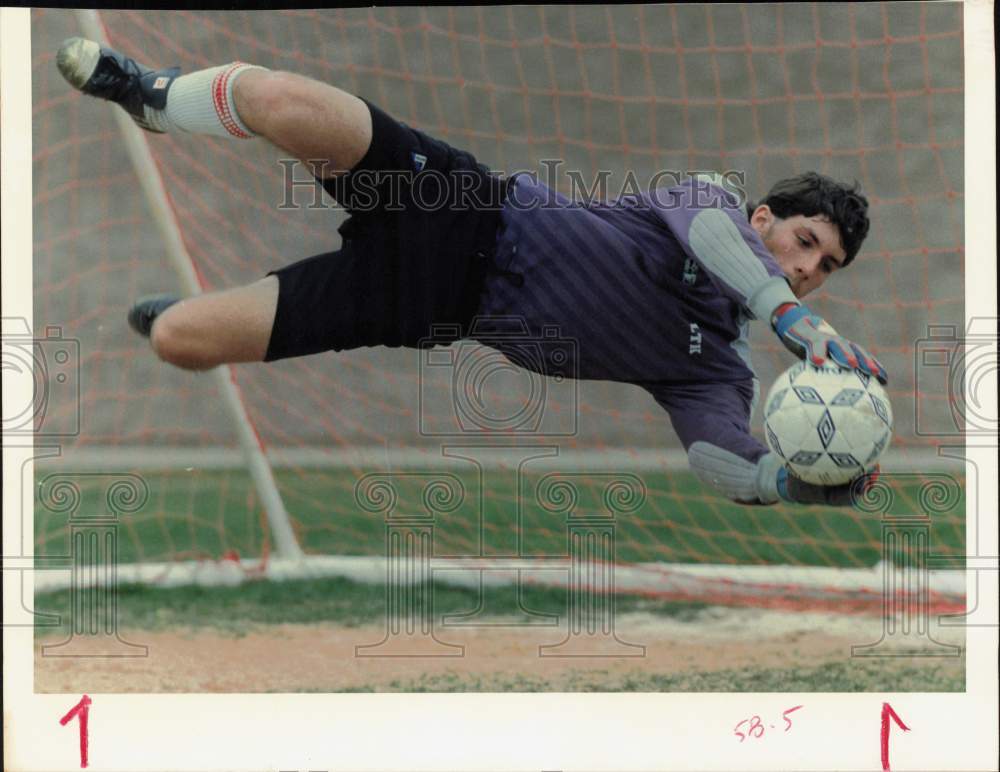 1988 Press Photo Katy Taylor High&#39;s soccer goalie Tim Girgenti leaps for ball.- Historic Images