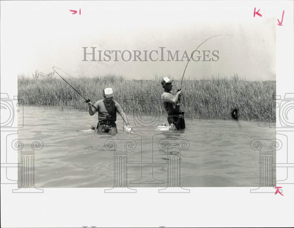 1985 Press Photo Two fishermen saltwater fishing. - hpa28900- Historic Images