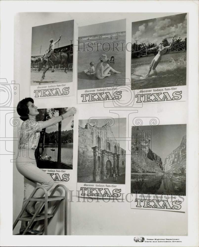 1963 Press Photo Joanne Clement hangs Texas' "Today's Fun-tier" posters.