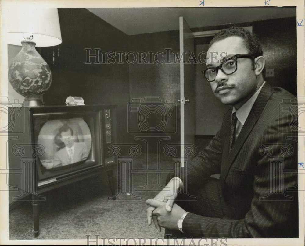 1969 Press Photo Curtis Graves, state representative, watches news program.