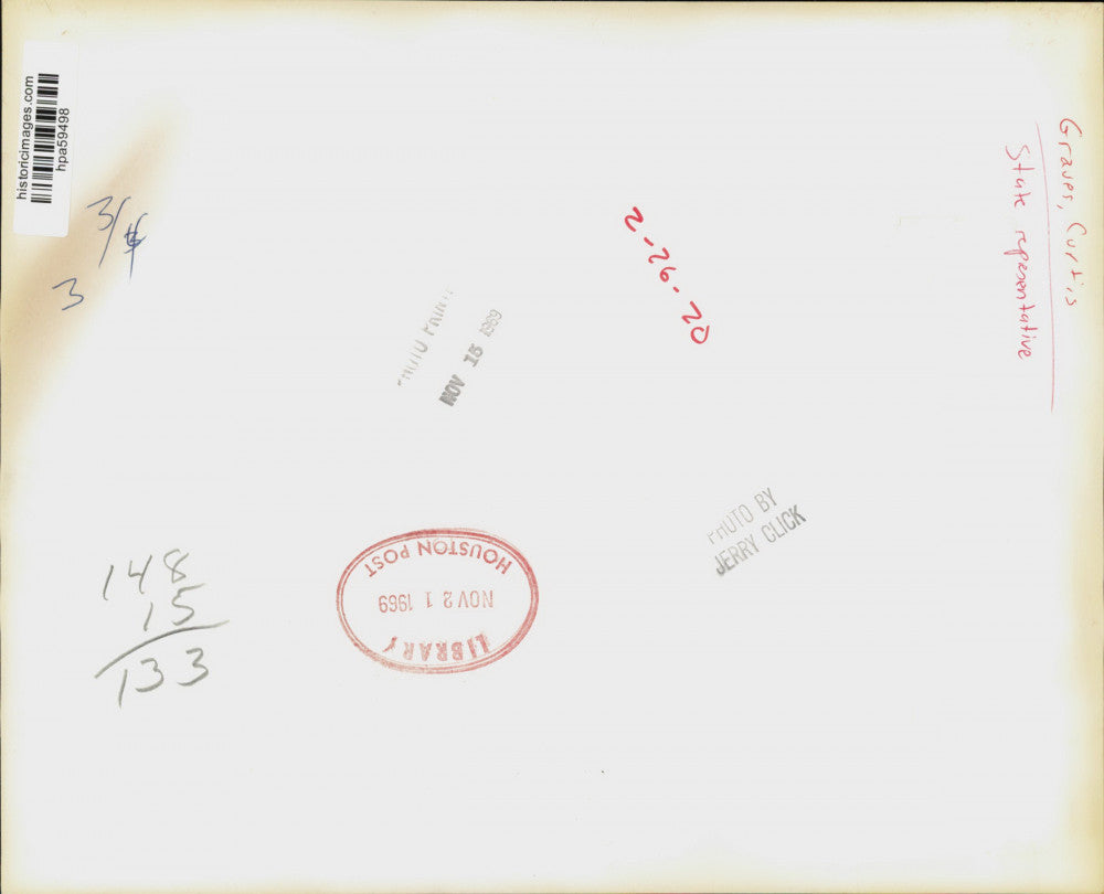 1969 Press Photo Curtis Graves, state representative, watches news program.