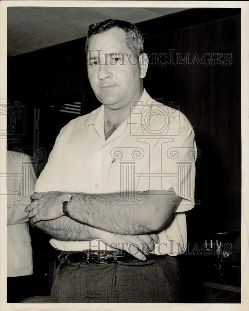 1962 Press Photo Ralph Cook, cab driver, stands with arms folded. - hpa59671- Historic Images