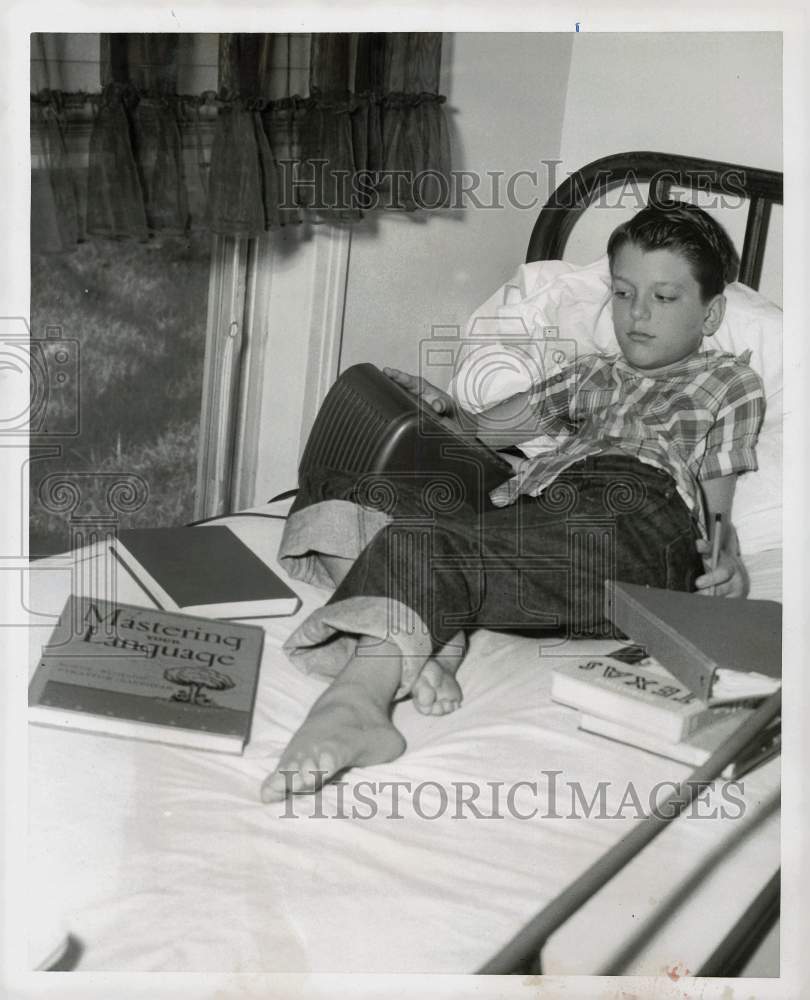 1959 Press Photo Paul Bingham studies classwork by telephone. - hpa60697- Historic Images