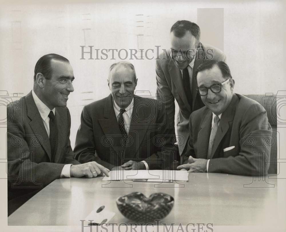 1957 Press Photo Eugene L. Green of Texas Butadiene confers with officials.- Historic Images