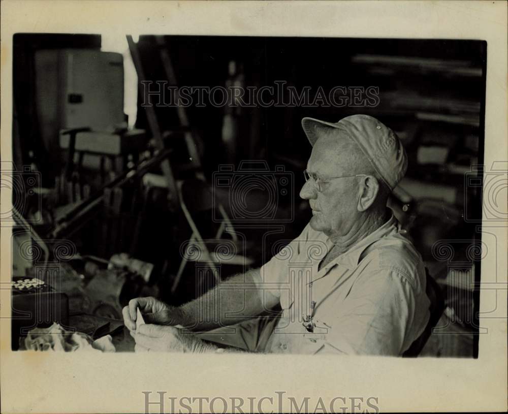 1967 Press Photo Ben Mewis, Bellville&#39;s blacksmith, works at table. - hpa72316- Historic Images