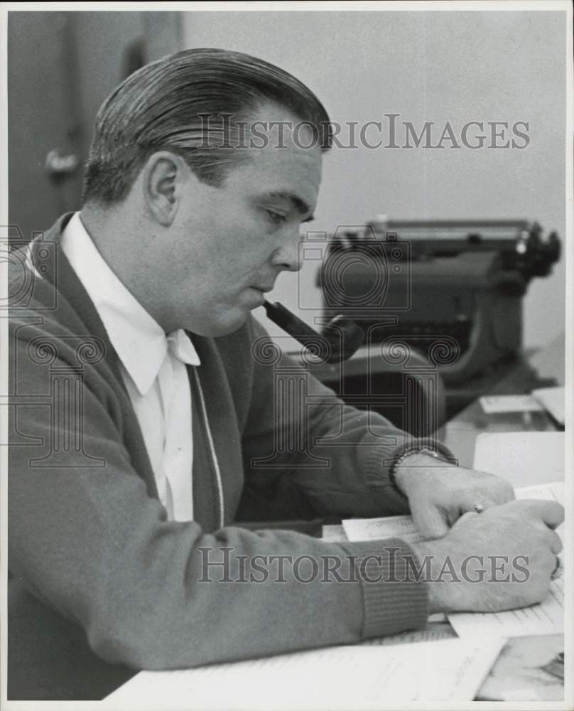 1959 Press Photo Melbourne Martin, Post staffer works at his desk. - hpa73720- Historic Images