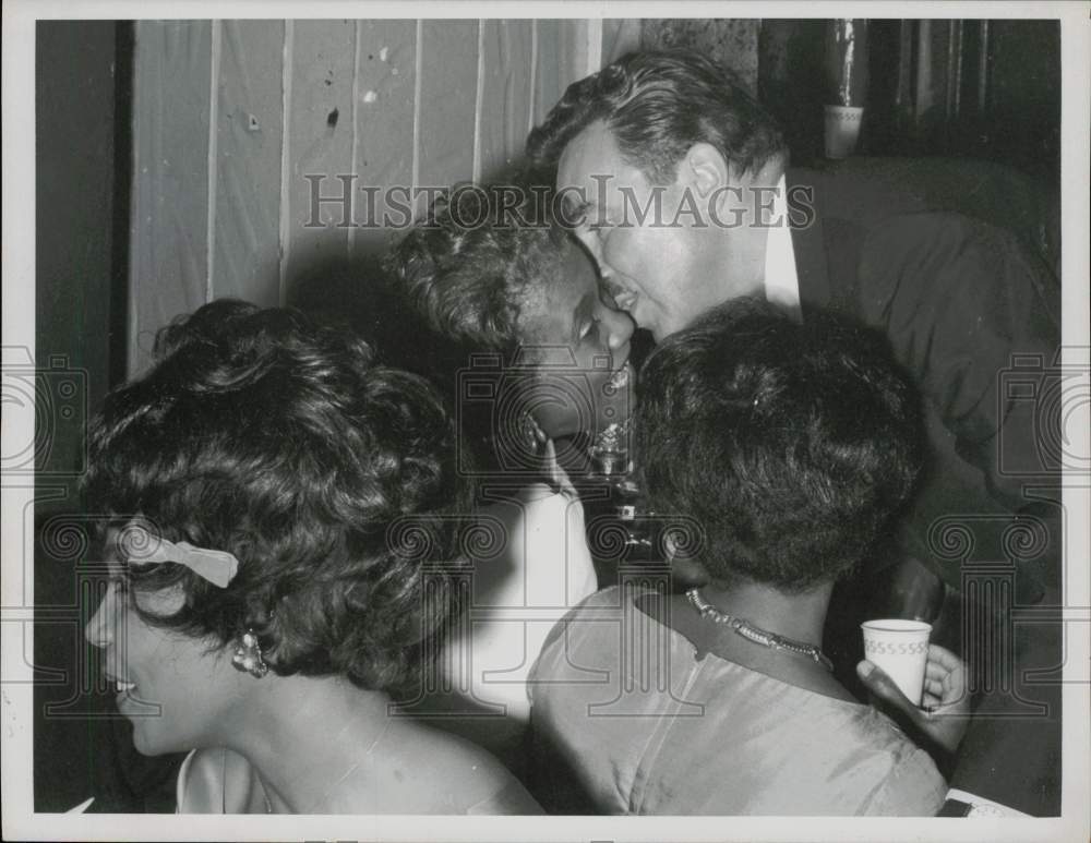 1963 Press Photo Adam Clayton Powell kisses well-wisher at New York fundraiser.- Historic Images