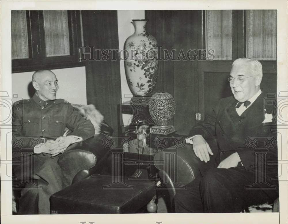 1956 Press Photo Paul V. McNutt, federal official, chatting with a visitor- Historic Images