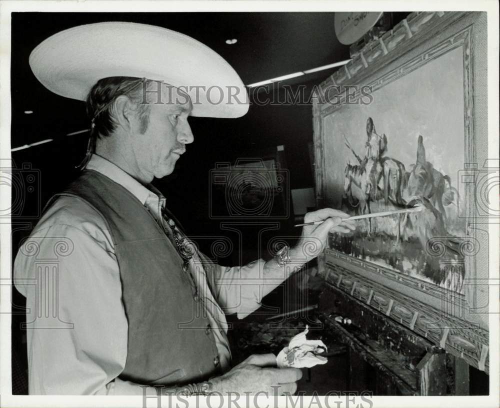 1973 Press Photo Kelly Pruitt, artist, puts finishing touches on painting.- Historic Images