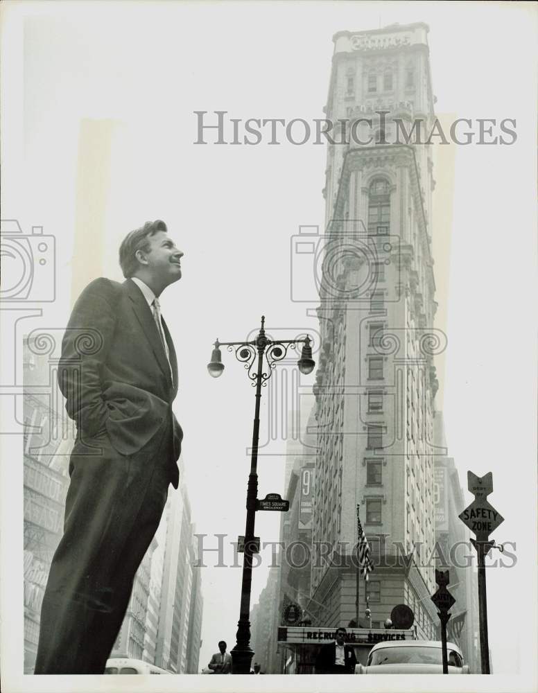 1956 Press Photo Herb Shriner, TV emcee, gazes at New York Times Square scenery.- Historic Images