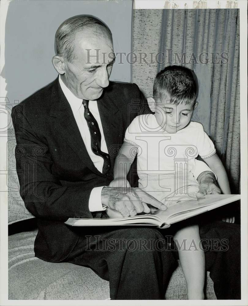 1960 Press Photo General Demetrios Georgantas reads with nephew Mark Georges.- Historic Images