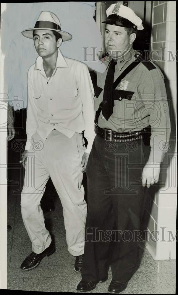 1954 Press Photo Santos Loa, robbery suspect escorted by officer. - hpa81426- Historic Images