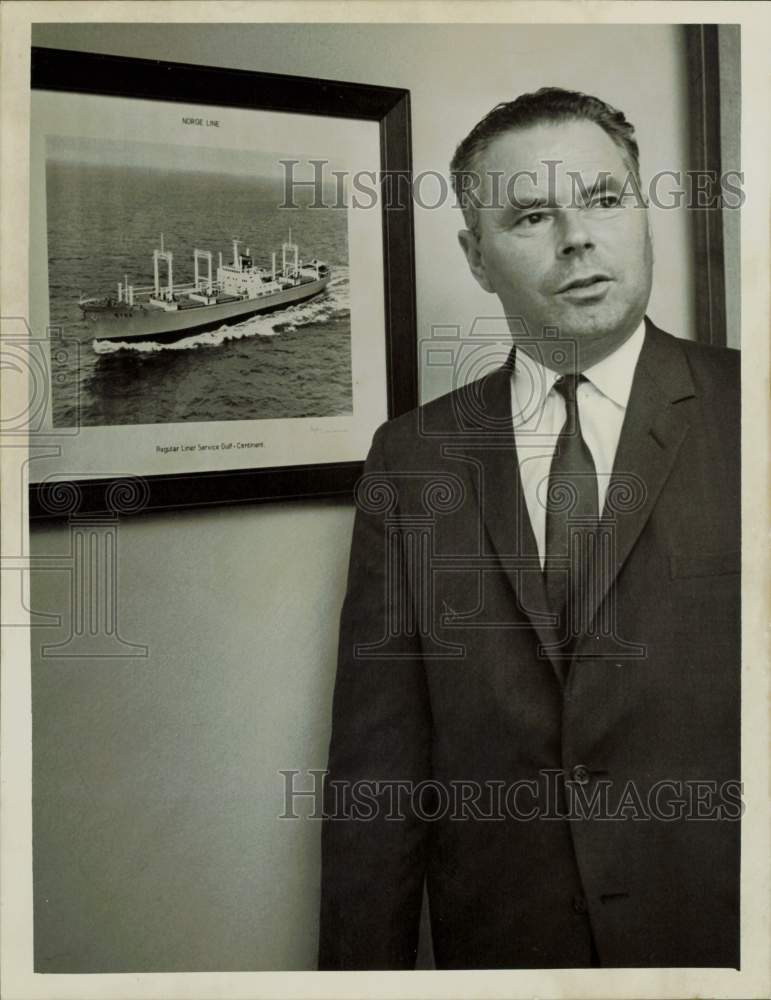 1963 Press Photo Johannes Presthus, Norway ship owner, poses near photo of ship.- Historic Images