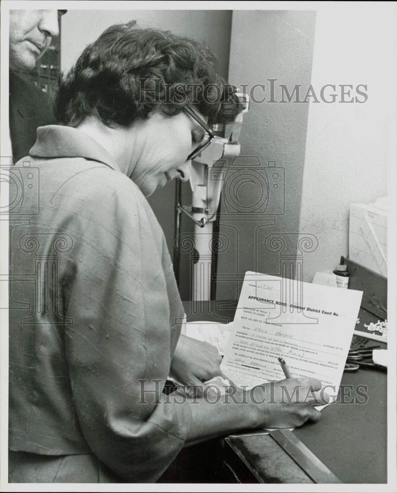 1964 Press Photo Mrs. James Brammer signs Appearance Bond document. - hpa83176- Historic Images