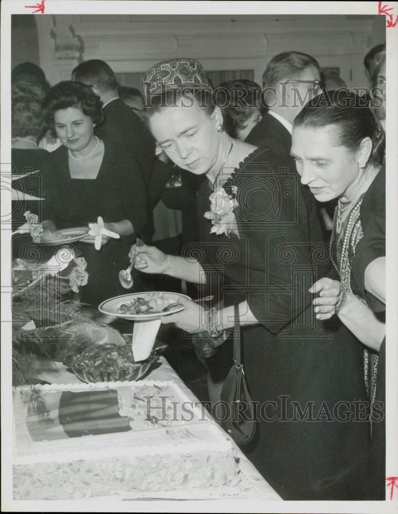 1963 Press Photo Mrs. Dean Rusk serves food at Lithuanian celebration.- Historic Images