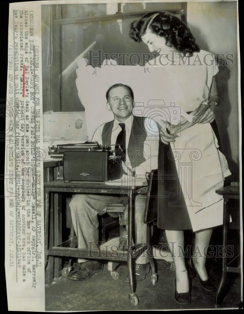 1948 Press Photo &quot;Mally Gesell&quot; walks past AP writer Hal Boyle&#39;s desk in NY.- Historic Images