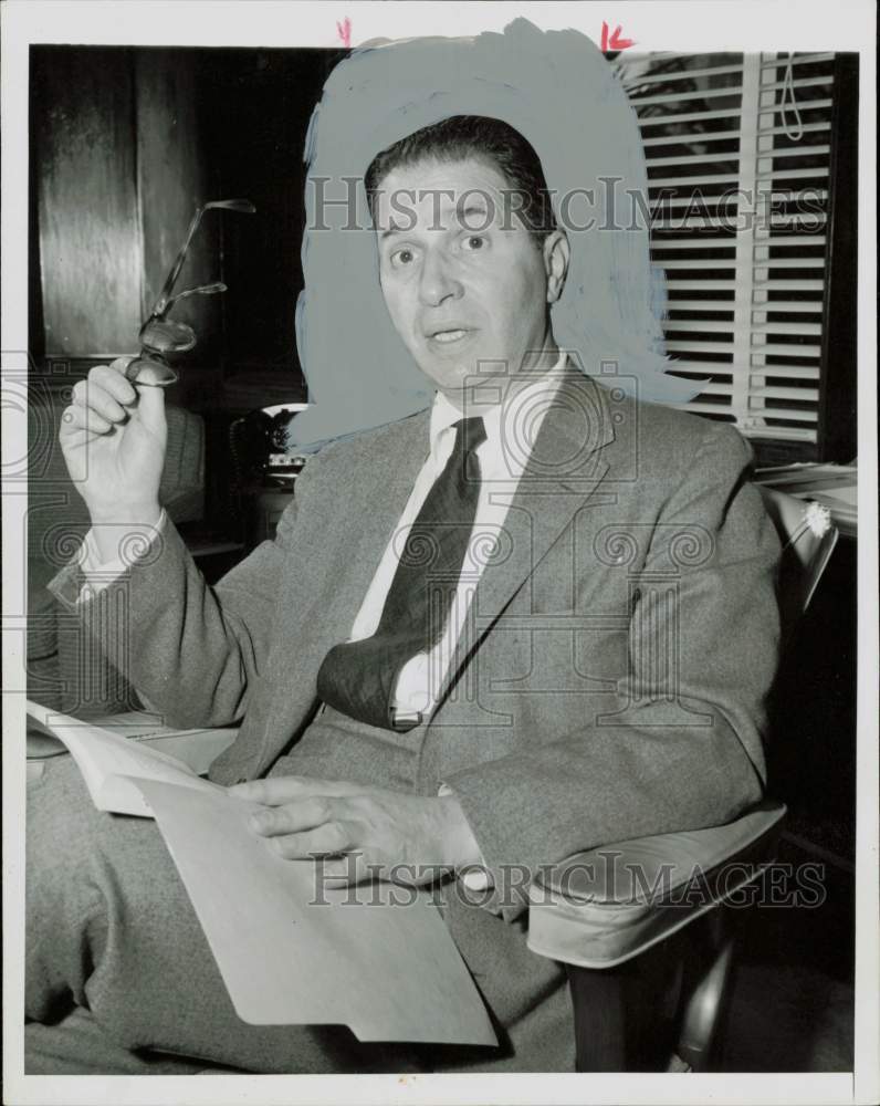 1957 Press Photo American author Adler Mortimer, Jr., holds his glasses.- Historic Images