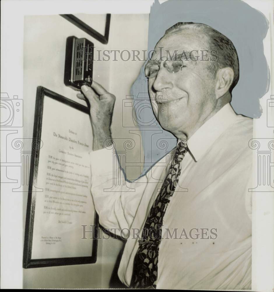 1957 Press Photo Senator Theodore Green checks temperature in Washington office.- Historic Images