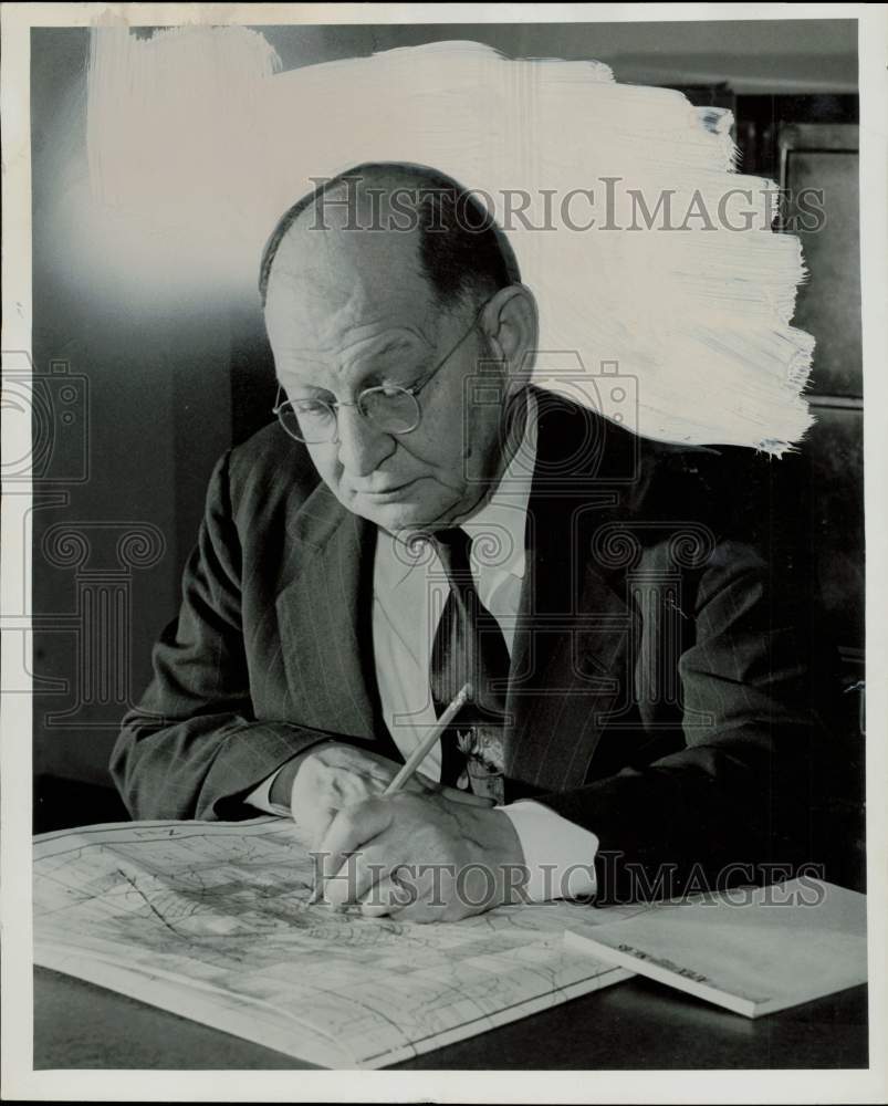 1956 Press Photo Paul Weaver, research geologist, checks map. - hpa84062- Historic Images