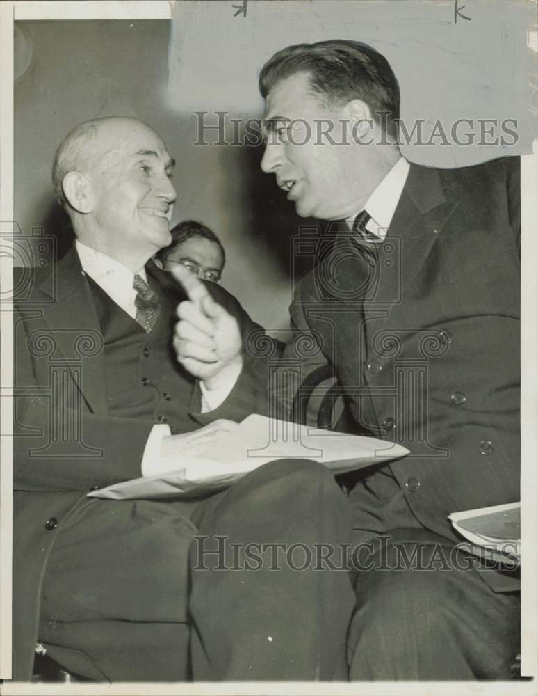 1958 Press Photo Edwin Johnson, right, points to another man. - hpa84104- Historic Images