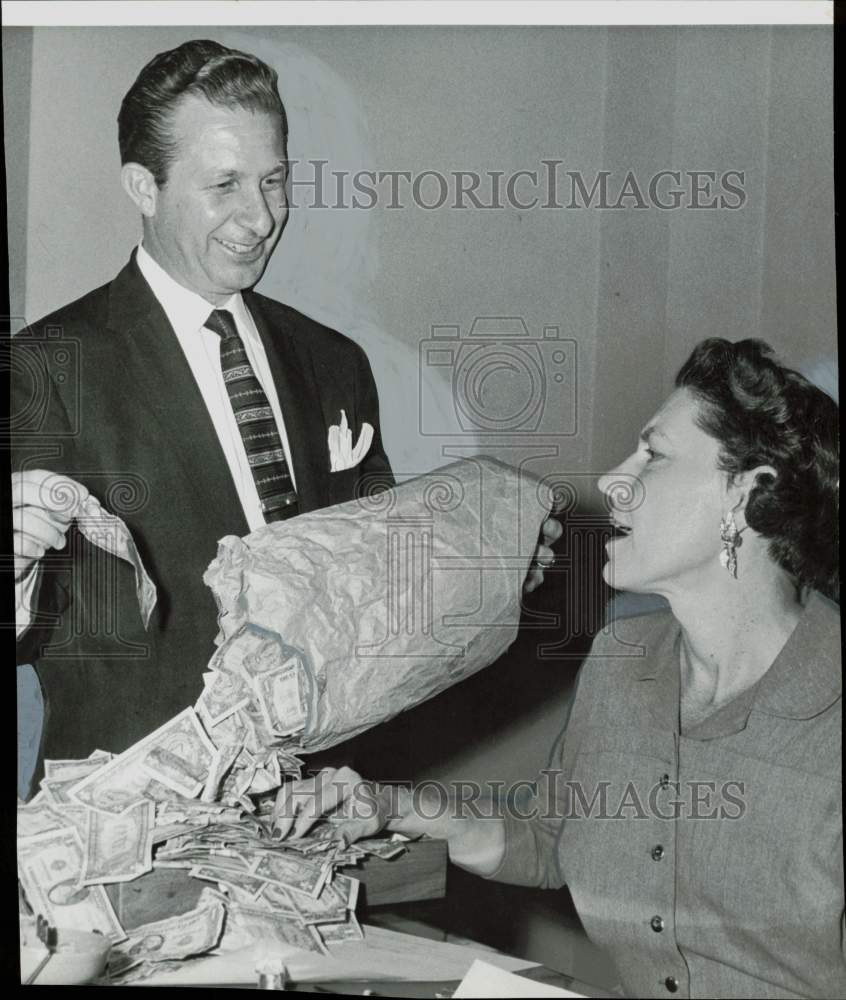 1957 Press Photo Cesare Galli pays candidate filing fee to Ann Cragg in $1 bills- Historic Images