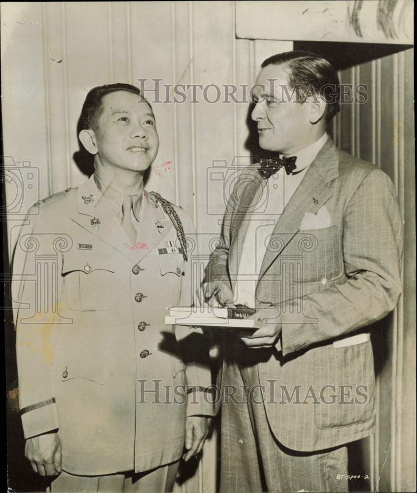 1956 Press Photo Colonel Carlos Romulo and James Young, author, confer.- Historic Images