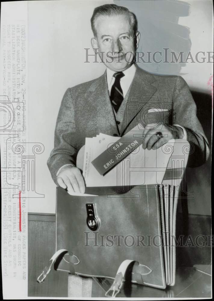 1951 Press Photo Eric Johnston packs briefcase at his Washington office.- Historic Images