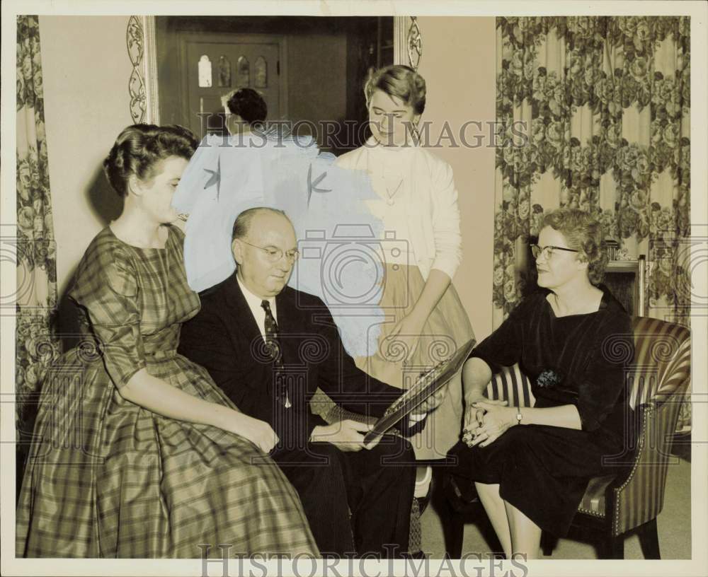 1957 Press Photo Dr. J.W. Edgar and family view A.Harris Award. - hpa84741- Historic Images