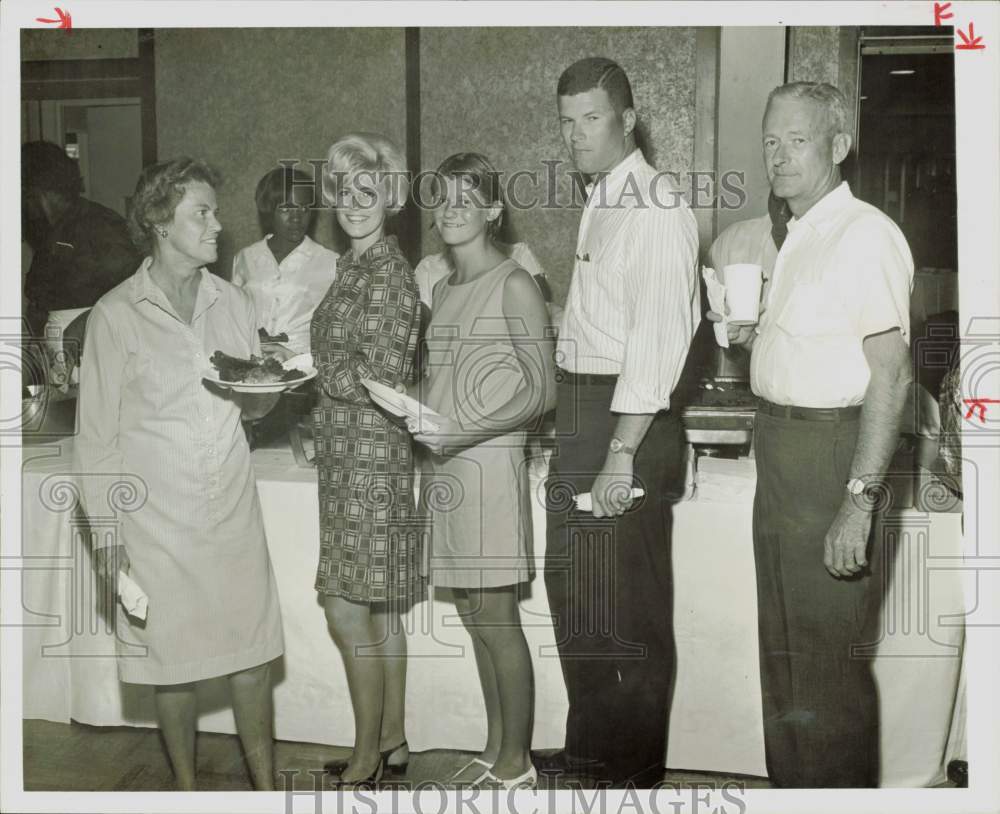 1967 Press Photo Mr. and Mrs. William Sandy and guests at Labor Day buffet.- Historic Images